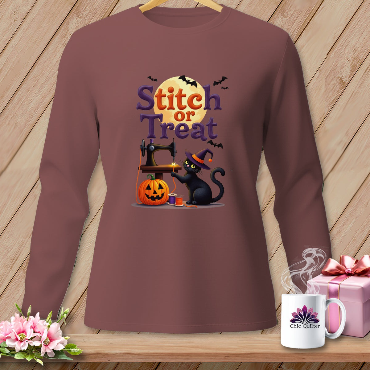 Black cat with witch hat sewing pumpkin with text "Stitch or Treat".