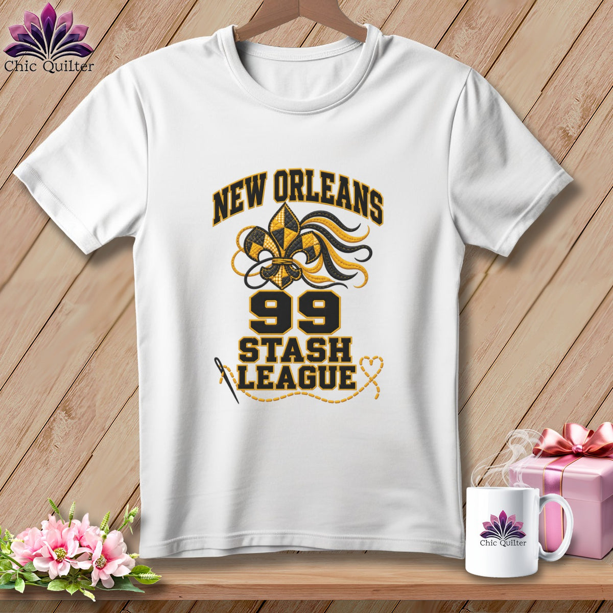White t-shirt with a New Orleans Stash League graphic featuring a gold and black fleur-de-lis.