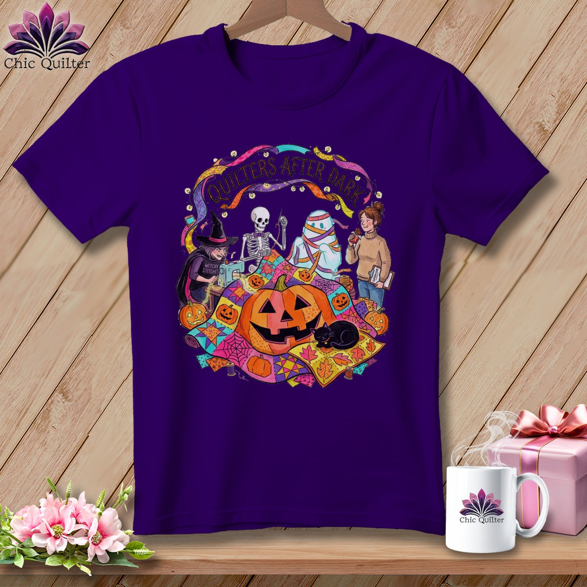 Purple t-shirt with Halloween quilting design featuring a witch, skeleton, mummy, and pumpkins.