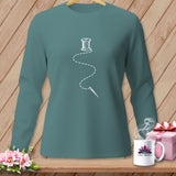 Teal long-sleeve shirt with a white spool of thread and needle graphic.