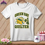 White t-shirt featuring Green Bay Quilter text and a cheese wedge pincushion design on wooden background.