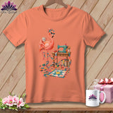 Peach t-shirt with flamingo, sewing machine, fabric, and quilt design.