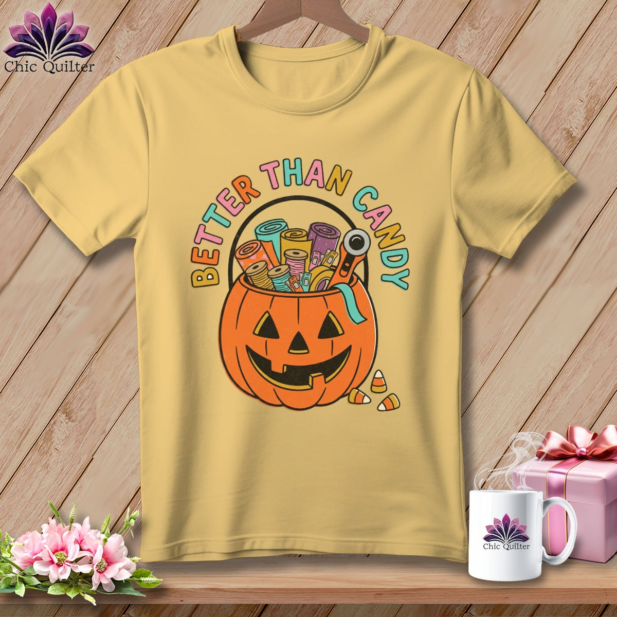 Yellow t-shirt with a Halloween pumpkin graphic and "BETTER THAN CANDY" text.