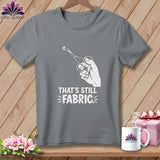 Gray t-shirt with scissors cutting fabric and text 