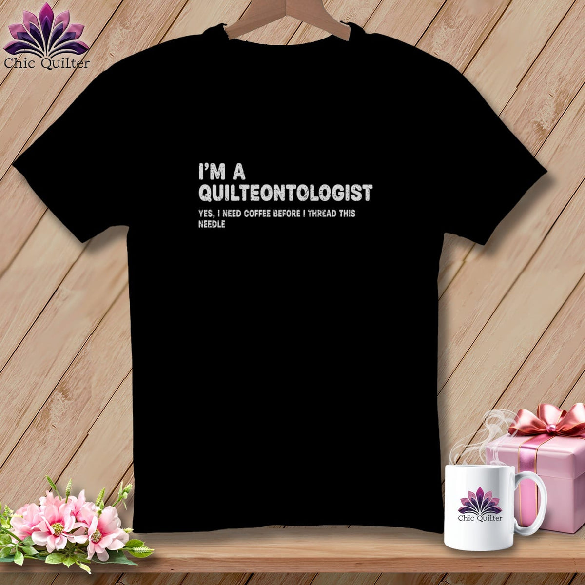 Black t-shirt with white text "I'm a Quilteontologist. Yes, I need coffee before I thread this needle."