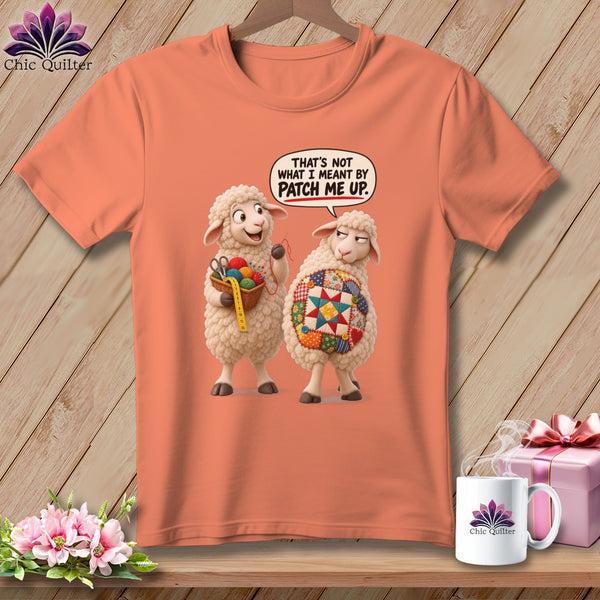 Two sheep on an orange t-shirt; one holds sewing supplies, the other a quilt.