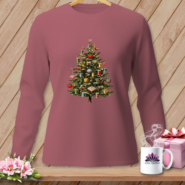 Long-sleeved shirt with a Christmas tree adorned with spools of thread and sewing notions.