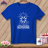Blue t-shirt with a white graphic of a quilt and the text 