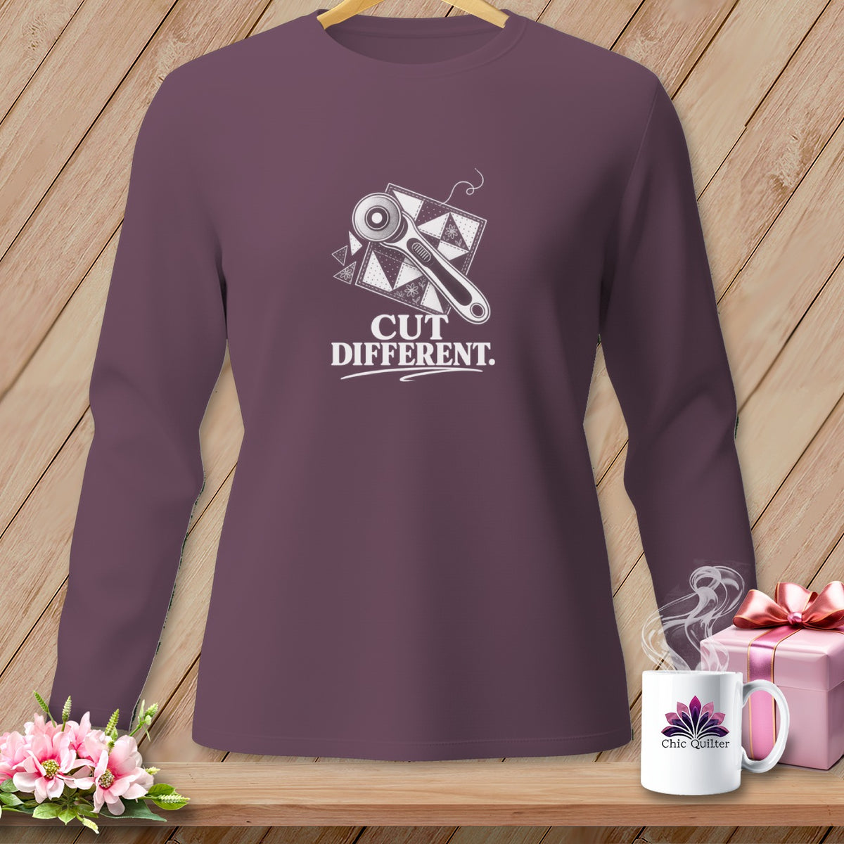 Purple long-sleeve shirt with "Cut Different" text and rotary cutter design.