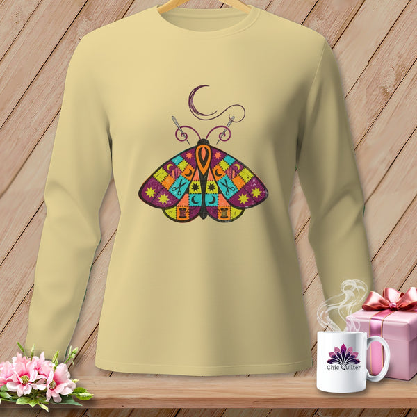 Light yellow long-sleeve shirt with a colorful patchwork moth graphic and crescent moon.