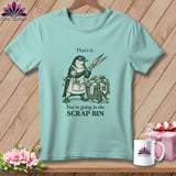 Light teal t-shirt with a penguin holding scissors and text that says 