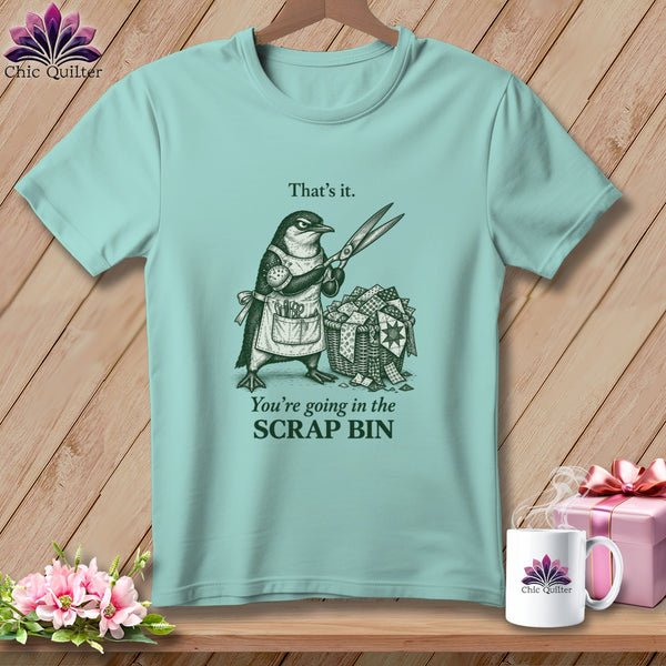 Light teal t-shirt with a penguin holding scissors and text that says "That's it. You're going in the SCRAP BIN."