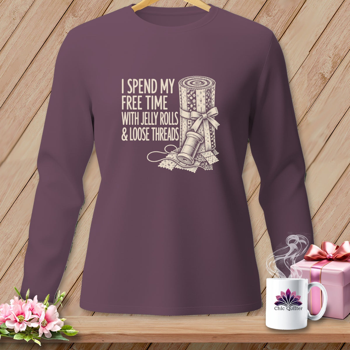 Purple long sleeve shirt with "I spend my free time with jelly rolls & loose threads" text.