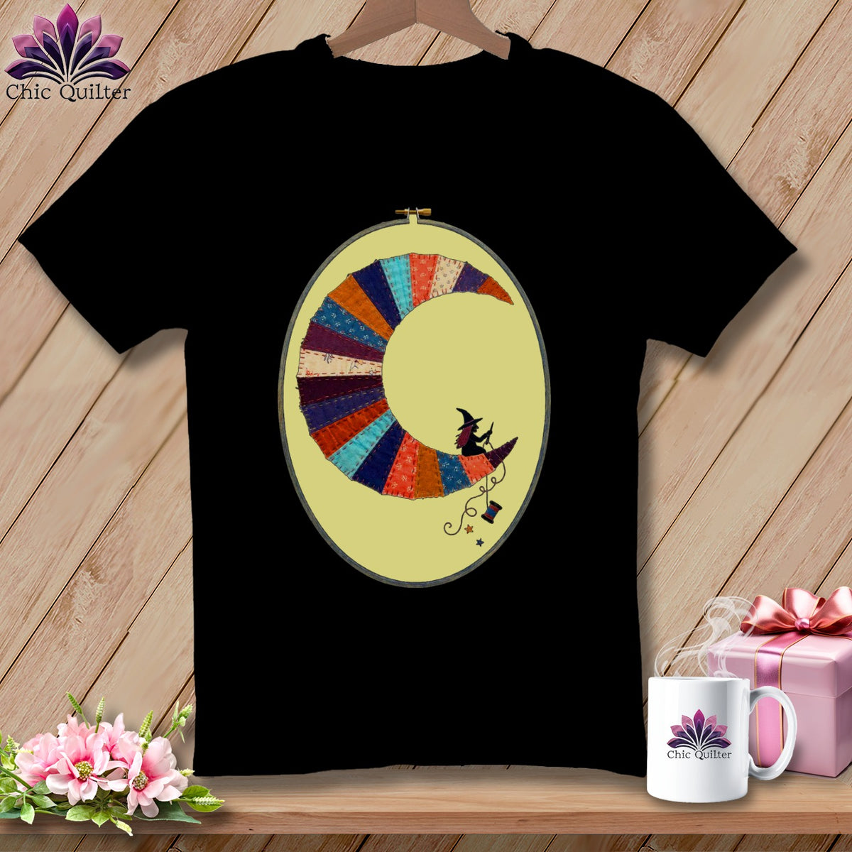 Black t-shirt with a crescent moon embroidery featuring two witches and stars.