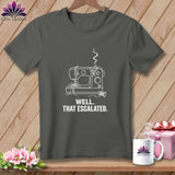 Dark grey t-shirt with white line art of a sewing machine and text: 