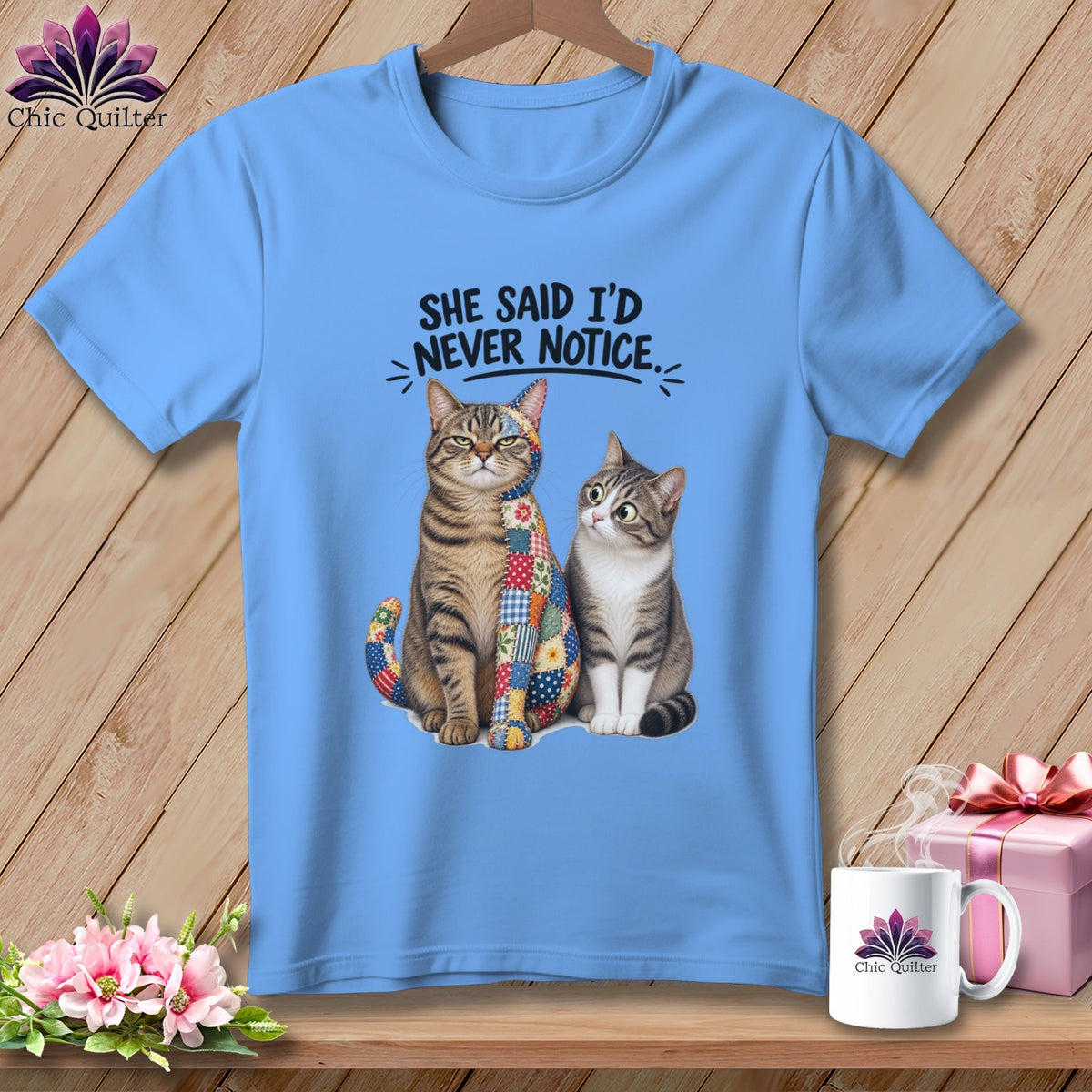 Blue t-shirt with two cats and text "SHE SAID I'D NEVER NOTICE."