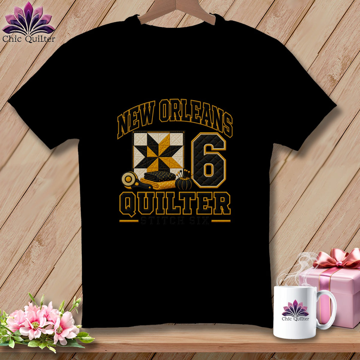 Black short-sleeved t-shirt with a New Orleans Quilter graphic featuring a quilt block and number six.