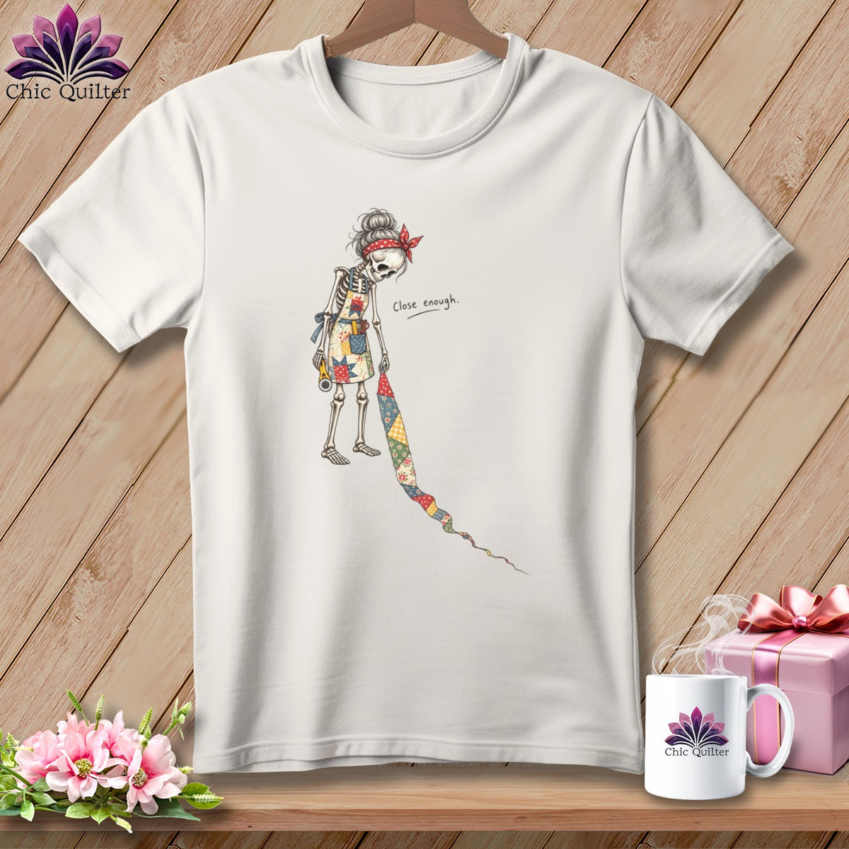 White t-shirt with a skeleton sewing, saying "close enough".