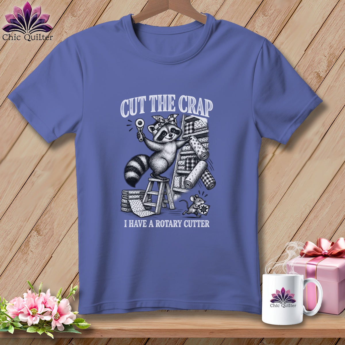 T-shirt with raccoon and mouse holding rotary cutter and fabric. Text: Cut the crap.