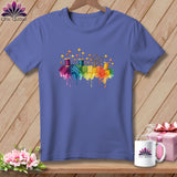 Purple t-shirt with colorful quilting supplies and rainbow watercolor splashes.