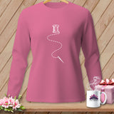 Pink long-sleeved shirt with white spool of thread and needle graphic.