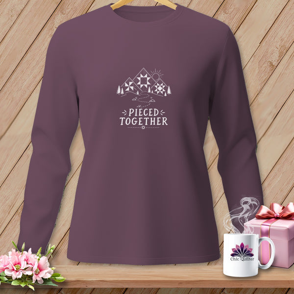 Plum long-sleeve shirt with mountain and quilt block graphic and "Pieced Together" text.