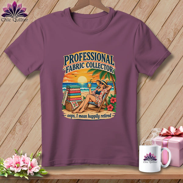 Plum-colored t-shirt with a vintage beach graphic and the text Professional Fabric Collector, Oops, I Mean Happily Retired.