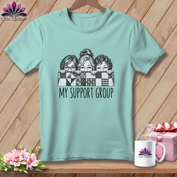T-shirt with three women behind a quilt pattern saying "MY SUPPORT GROUP".