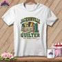 A white t-shirt featuring a Jacksonville Quilter graphic with fabric bolts, a wooden crate, and a measuring tape.