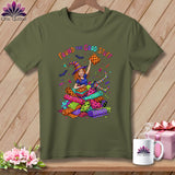 Green t-shirt with a cartoon witch holding fabric and the text 
