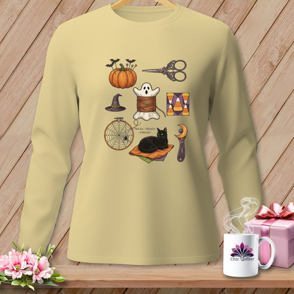 Light yellow long-sleeve shirt with Halloween sewing graphic and text "Tricks, Treats, Thread".