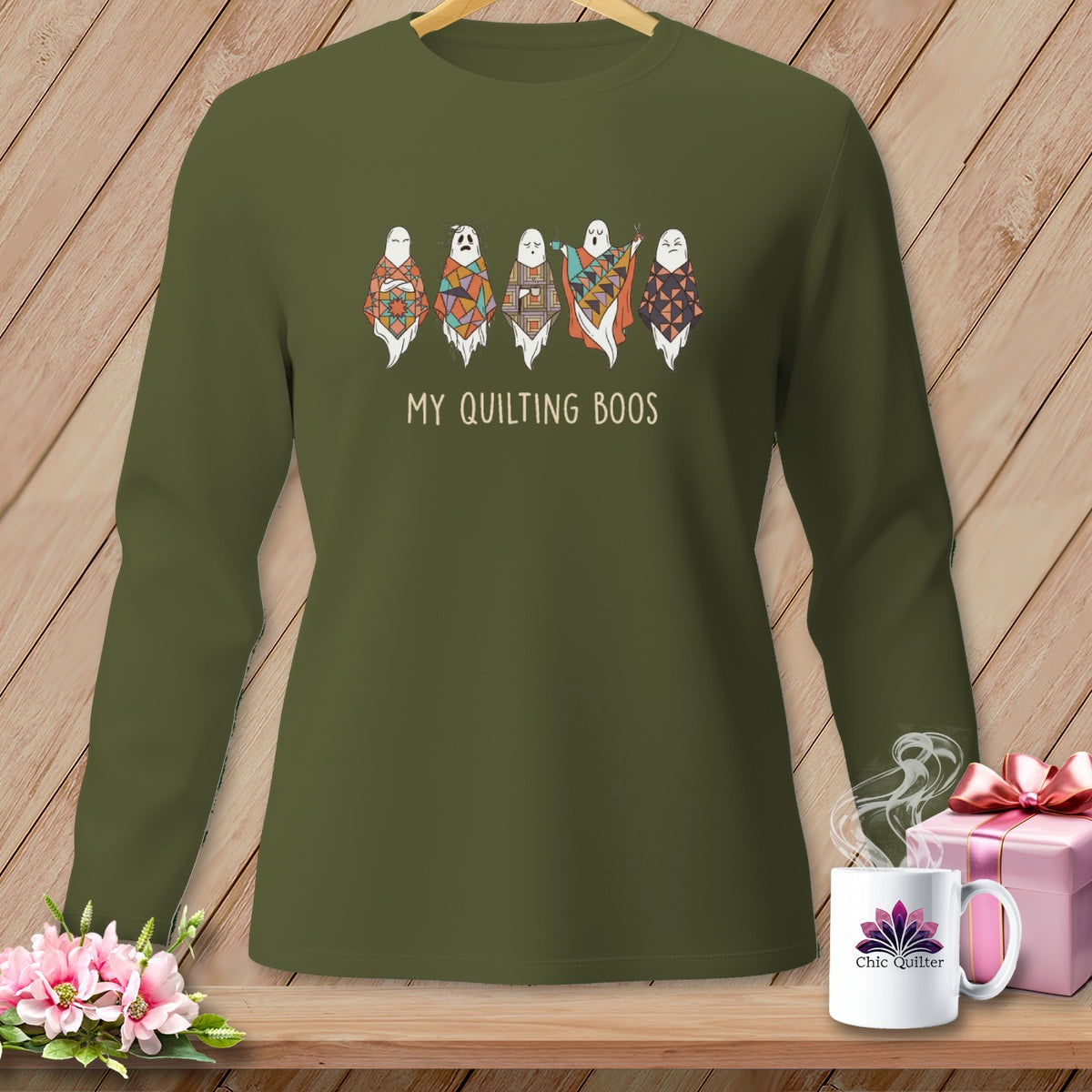 Green long-sleeved shirt with five quilted ghosts and text "MY QUILTING BOOS".