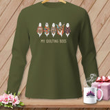 Green long-sleeved shirt with five quilted ghosts and text 