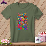 An olive green t-shirt displays a graphic of a colorful, feathered owl in a basket with the text Scrappy & Happy.