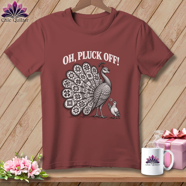 A dark red t-shirt printed with a peacock graphic and the white text, OH, PLUCK OFF!