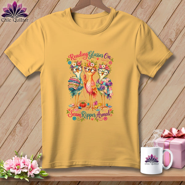 Yellow t-shirt featuring three birds wearing glasses and flower crowns, with text reading Reading Glasses On Seam Ripper Armed.