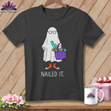 T-shirt graphic of a ghost with glasses, holding a craft bag, wearing sneakers, with 