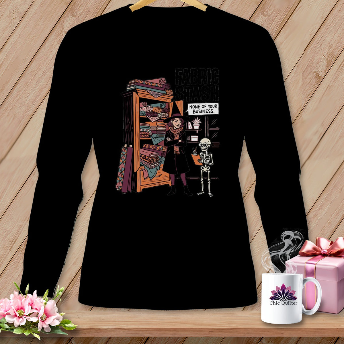 Long sleeve black shirt with "Fabric Stash None of Your Business" graphic.