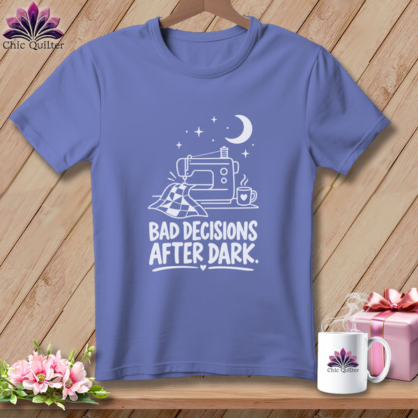 Periwinkle t-shirt with white graphic of sewing machine, quilt, mug, moon and stars, and text.
