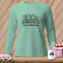 Mint long-sleeve shirt with a graphic of three bats drinking wine, saying "we're a little batty".