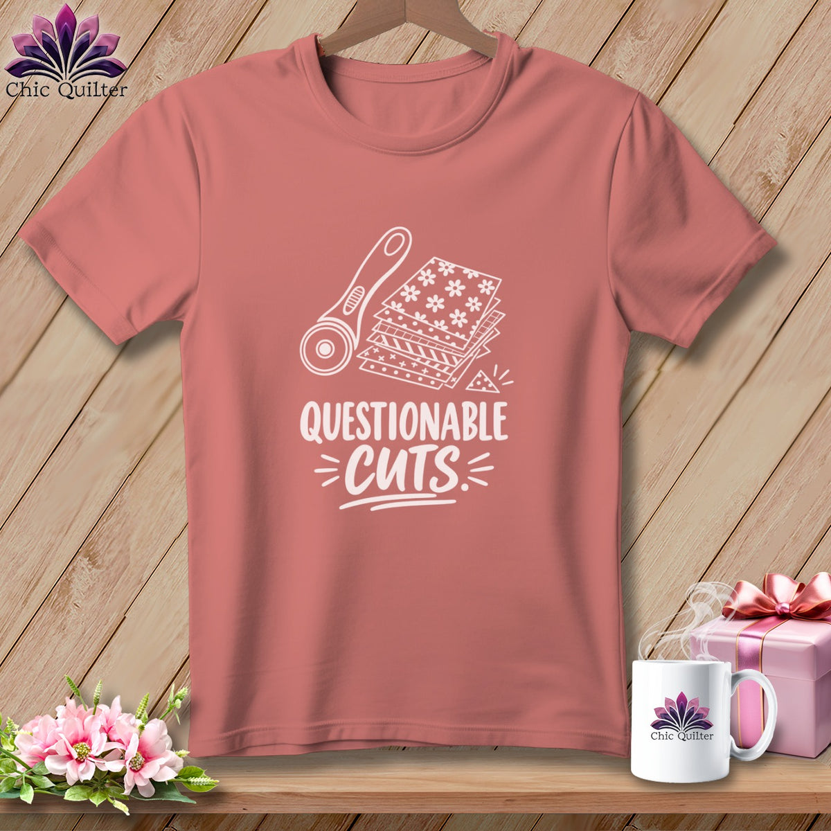 Rose t-shirt with "Questionable Cuts" graphic of rotary cutter and fabric scraps.