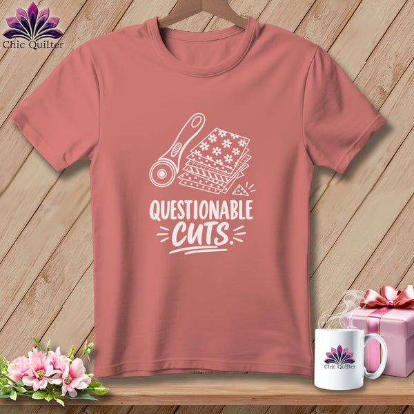 Rose t-shirt with "Questionable Cuts" graphic of rotary cutter and fabric scraps.