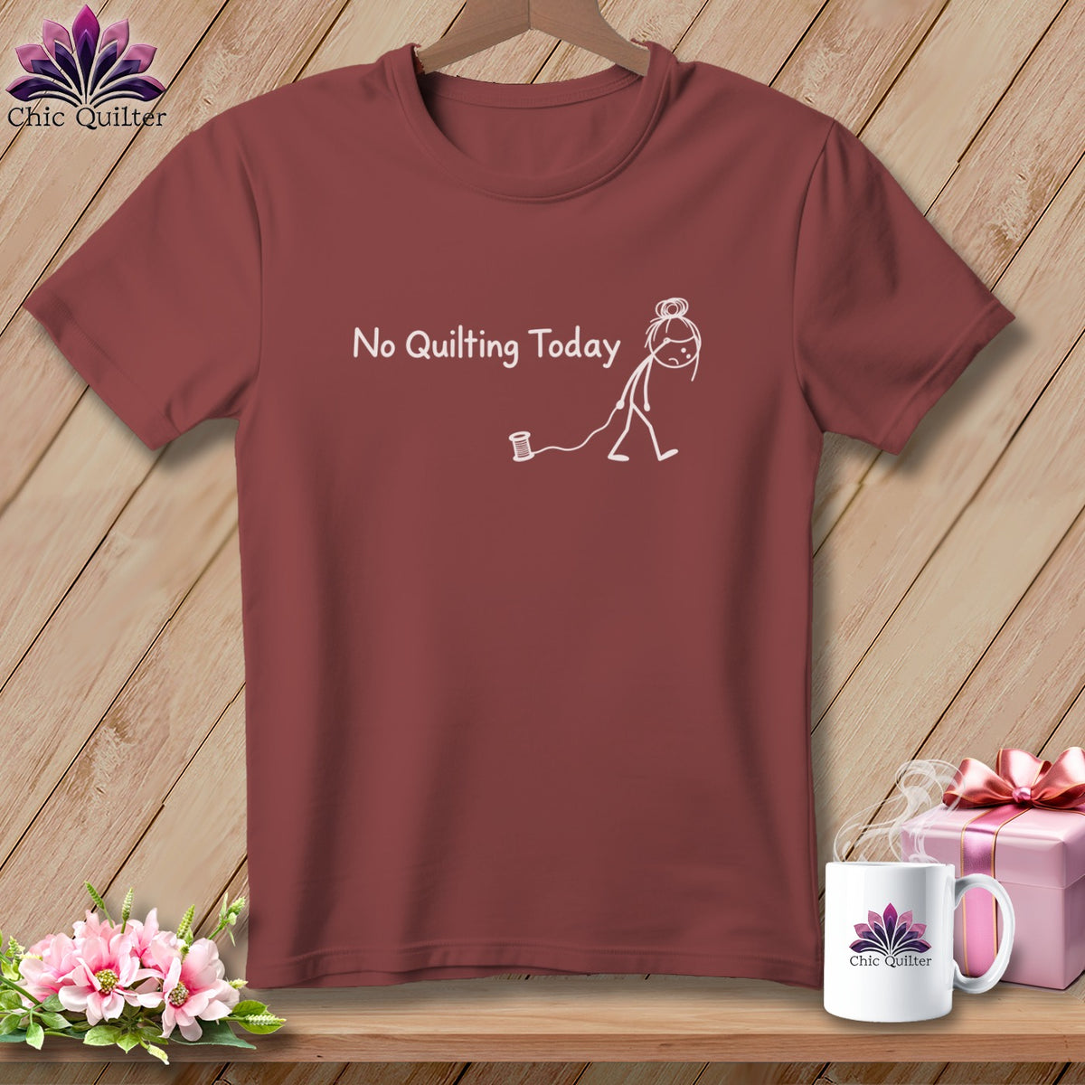 Maroon t-shirt with white text and stick figure graphic: "No Quilting Today".