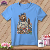 Bear sewing with fabric and thread, mug reads 