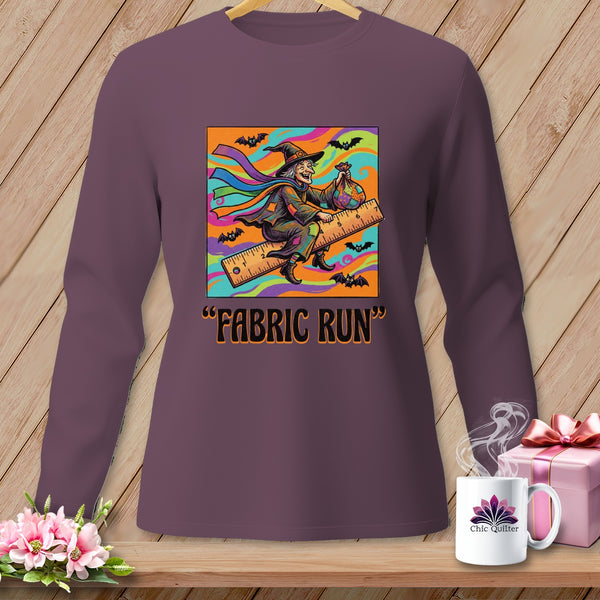Witch flying on a ruler with a bag of fabric and text "FABRIC RUN".