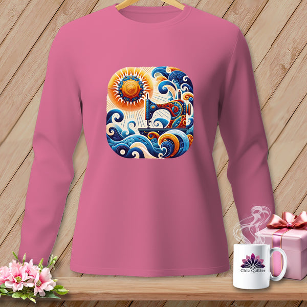 Pink long sleeve shirt with a graphic of a sewing machine, sun, and waves.