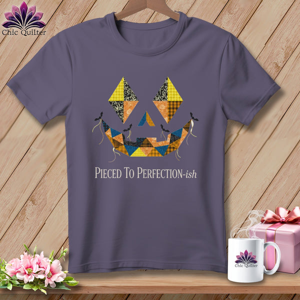Purple t-shirt with a patchwork jack-o'-lantern face and "Pieced To Perfection-ish" text.