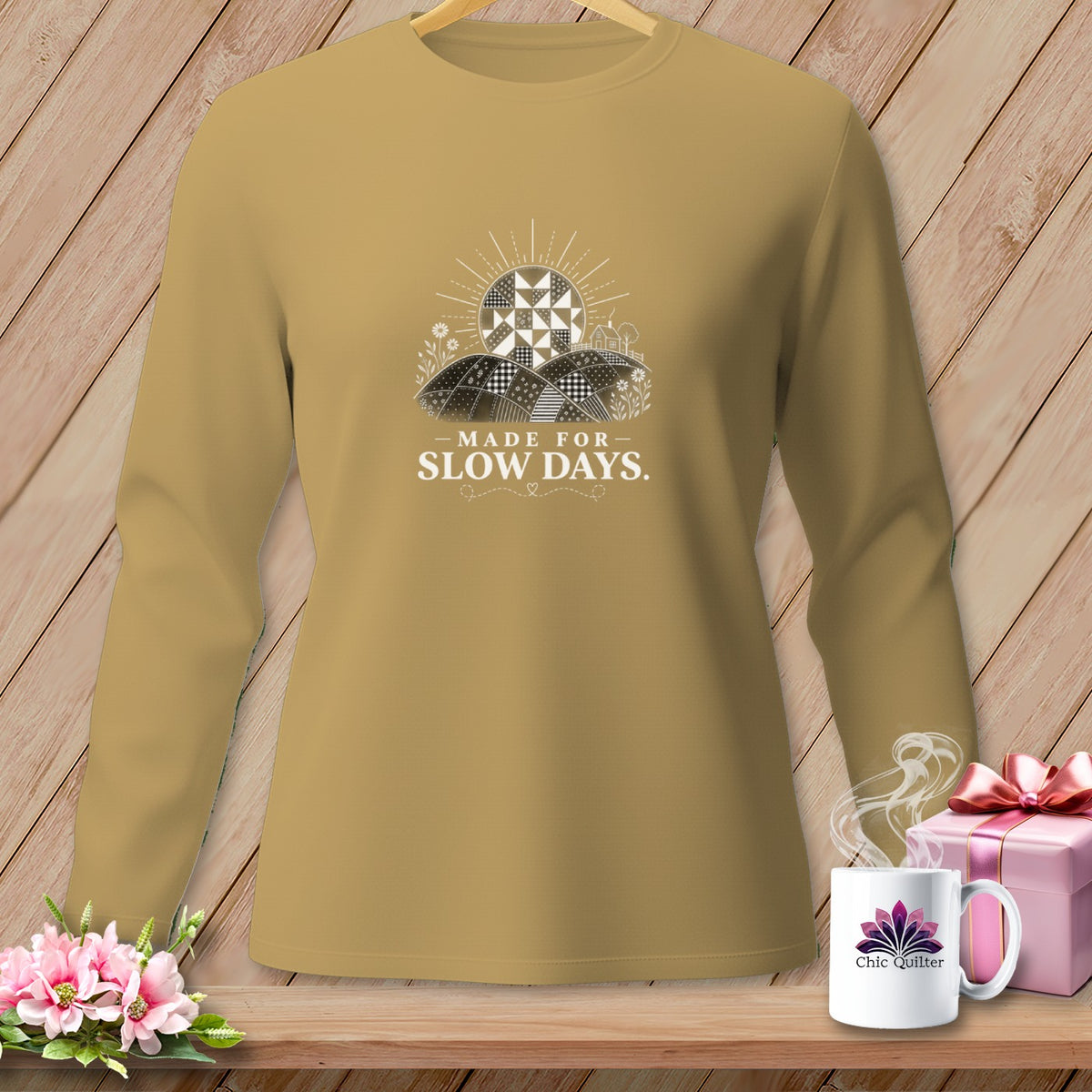 Tan long-sleeve shirt with "MADE FOR SLOW DAYS." text and quilted sun design.