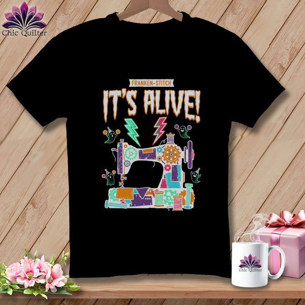 Black t-shirt with Franken-stitch "It's Alive!" sewing machine graphic.