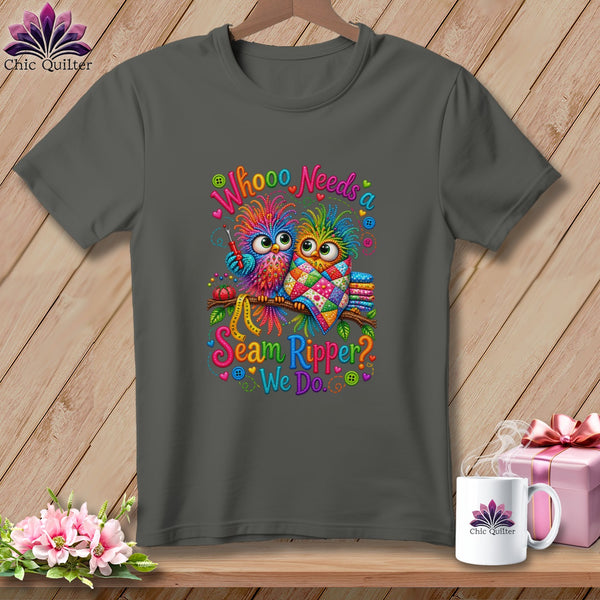 Dark gray t-shirt featuring two colorful owls, sewing tools, and the text Whooo Needs a Seam Ripper? We Do.
